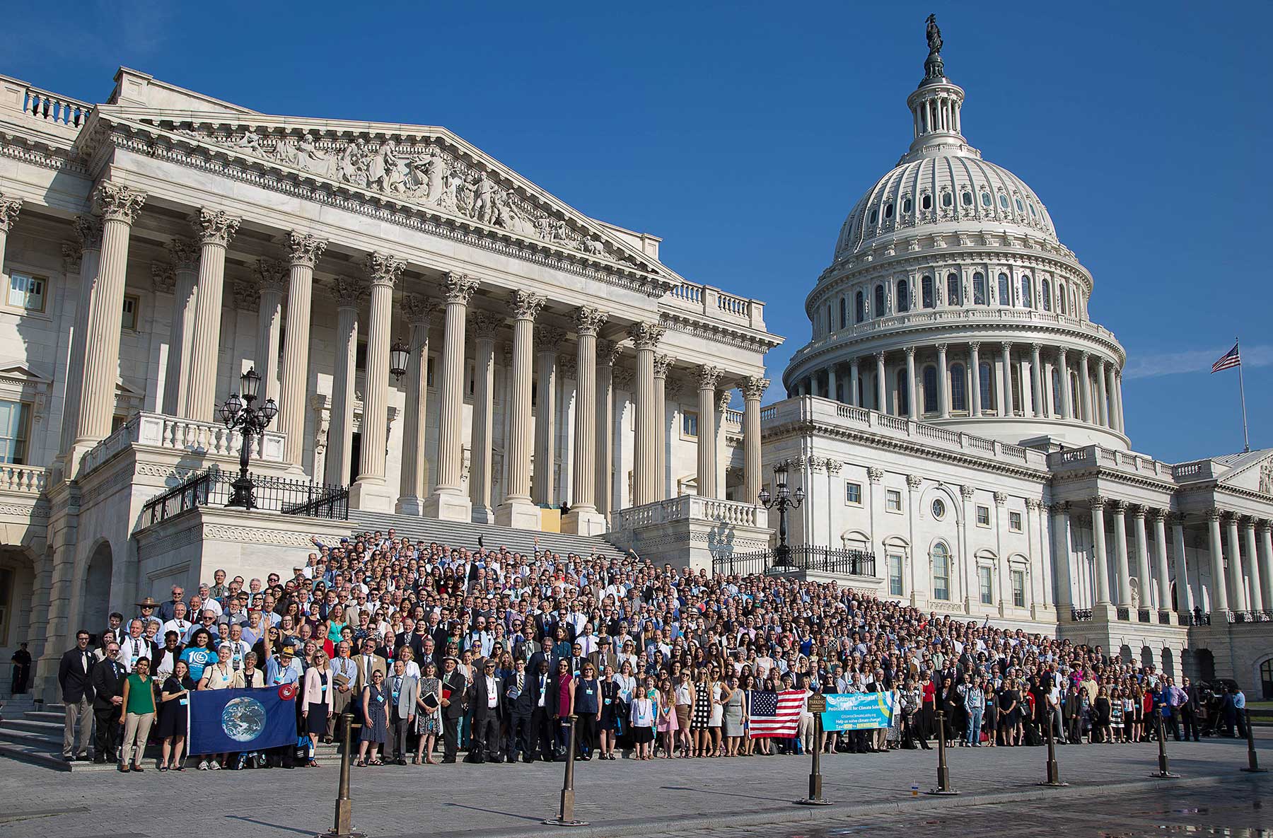 carbon pricing advocates on steps of Congress