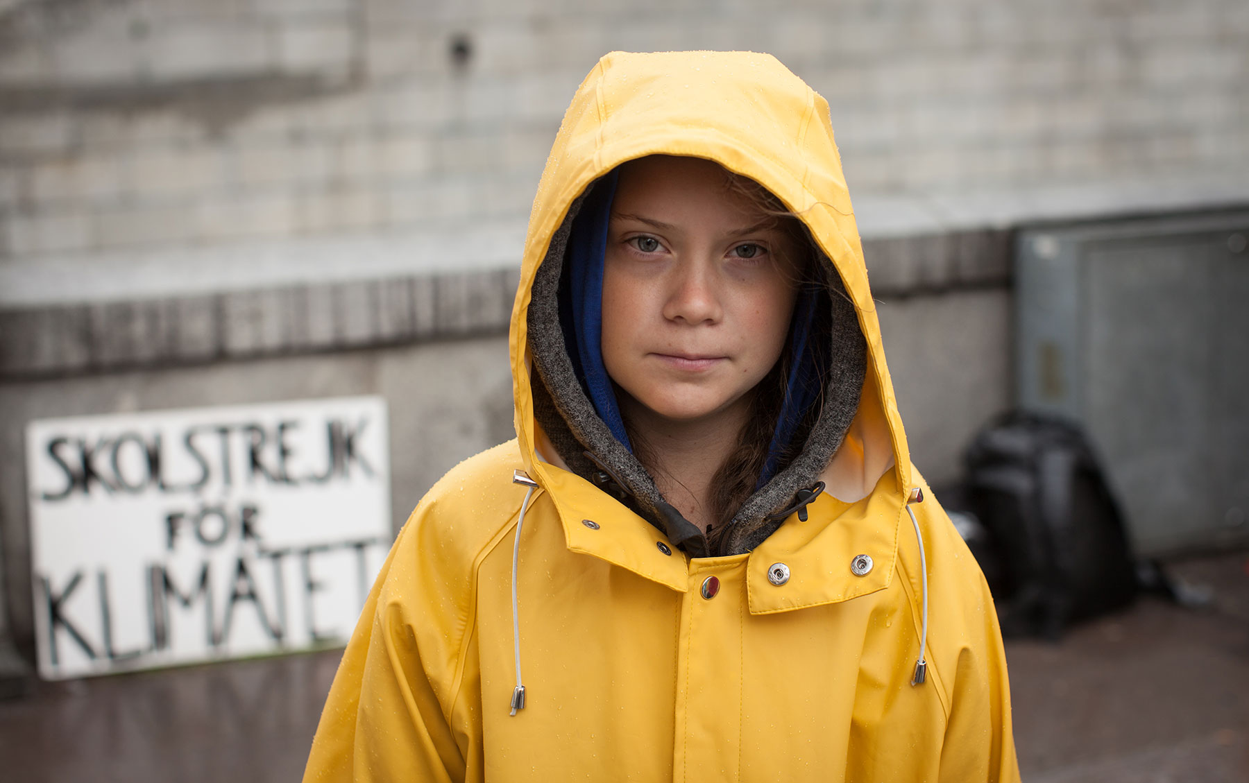 Greta Thunberg with protest sign